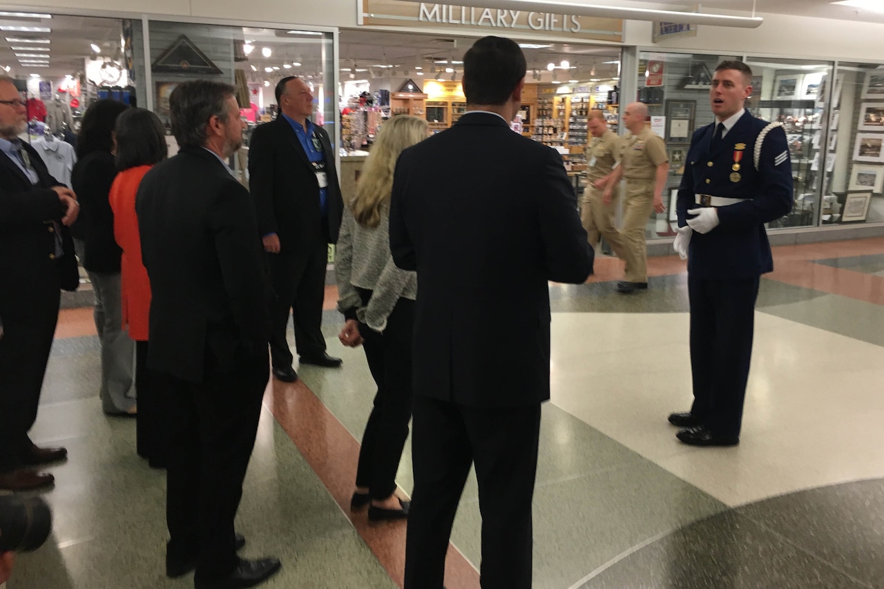 A man talks to a group.