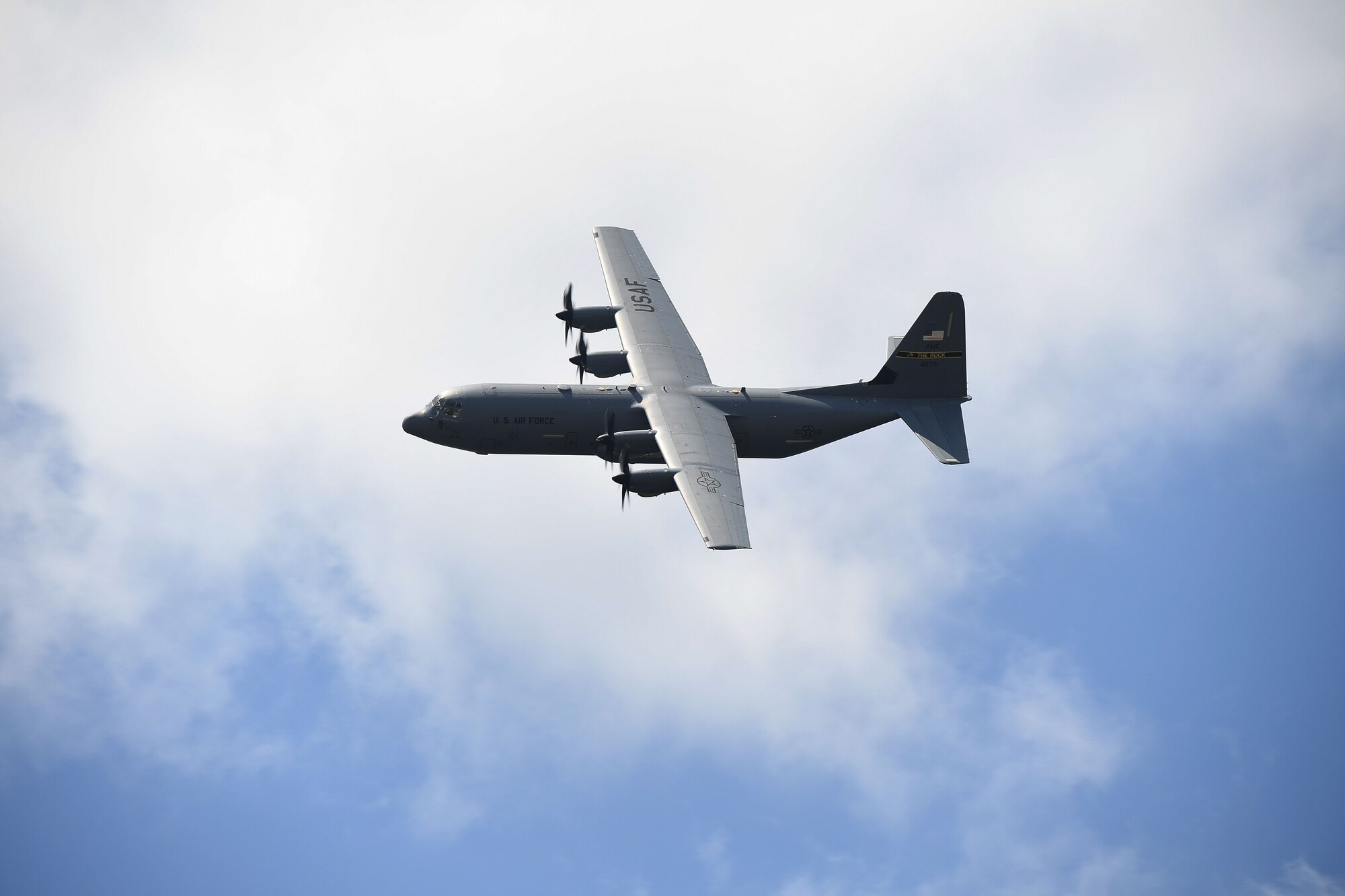 An Airman prepare for take-off in a C-130J