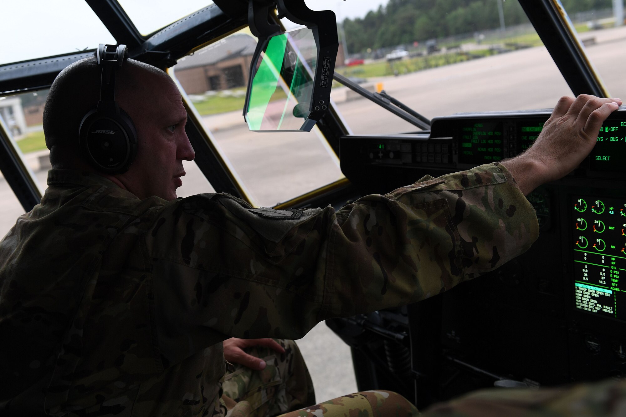 An Airman prepare for take-off in a C-130J