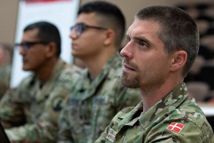 Danish Home Guard Sgt. 1st Class Thomas Nielsen, leadership instructor, right, listens alongside his U.S. Army counterparts during an Army Reserve Company Leader Development Course at Fort McCoy, Wisconsin, June 20, 2019. The Danish Home Guard is partnered with the 83rd Army Reserve Training Center through the Military Reserve Exchange Program. (U.S. Army photo by Mark R. W. Orders-Woempner)