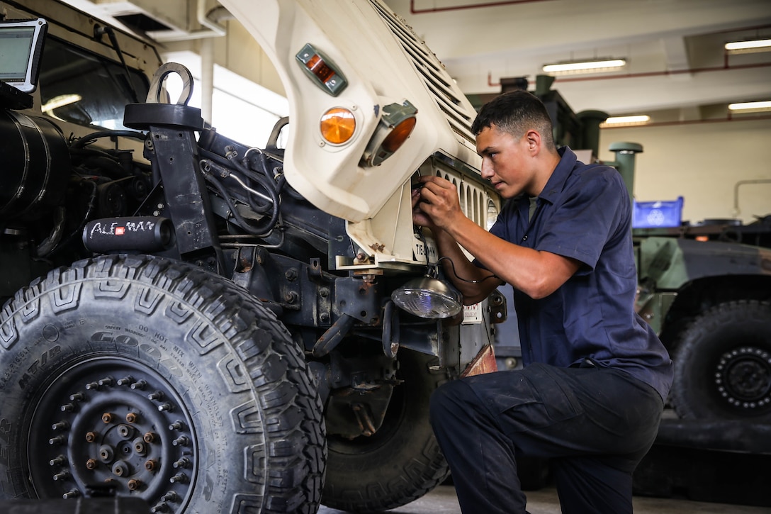 U.S. Marines with a Maintenance Support Team perform maintenance on High Mobility Multipurpose Wheeled Vehicles on Camp Foster, Okinawa, Japan, June 18, 2019. The purpose of an MST is to send a team of Marines from outside units to temporarily provide support to units who are in need of manpower in specific Military Occupational Specialties. (U.S. Marine Corps photo by Sgt. Hailey D. Clay)