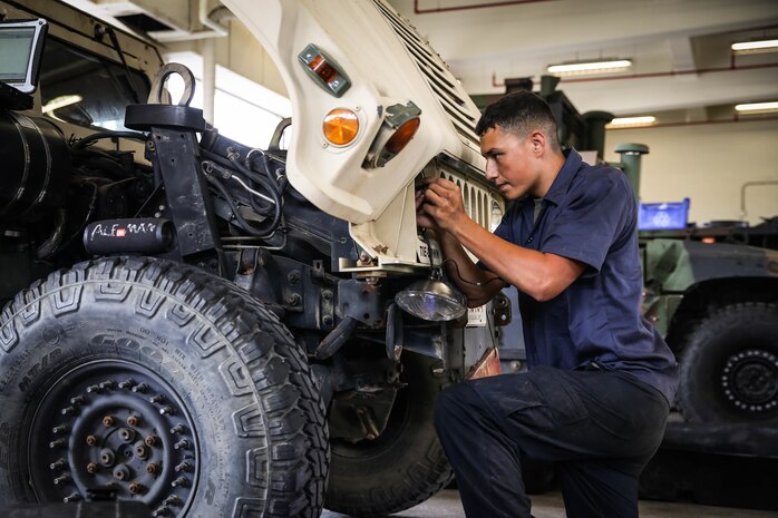 U.S. Marines with a Maintenance Support Team perform maintenance on High Mobility Multipurpose Wheeled Vehicles on Camp Foster, Okinawa, Japan, June 18, 2019. The purpose of an MST is to send a team of Marines from outside units to temporarily provide support to units who are in need of manpower in specific Military Occupational Specialties. (U.S. Marine Corps photo by Sgt. Hailey D. Clay)