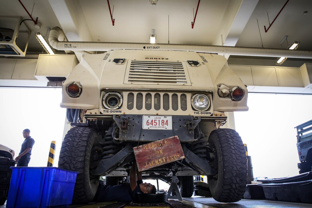U.S. Marines with a Maintenance Support Team perform maintenance on High Mobility Multipurpose Wheeled Vehicles on Camp Foster, Okinawa, Japan, June 18, 2019. The purpose of an MST is to send a team of Marines from outside units to temporarily provide support to units who are in need of manpower in specific Military Occupational Specialties. (U.S. Marine Corps photo by Sgt. Hailey D. Clay)