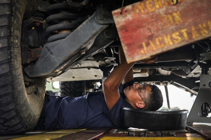 U.S. Marines with a Maintenance Support Team perform maintenance on High Mobility Multipurpose Wheeled Vehicles on Camp Foster, Okinawa, Japan, June 18, 2019. The purpose of an MST is to send a team of Marines from outside units to temporarily provide support to units who are in need of manpower in specific Military Occupational Specialties. (U.S. Marine Corps photo by Sgt. Hailey D. Clay)