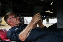 U.S. Marine Corps Cpl. Collin Lourie performs maintenance on a Medium Tactical Vehicle Replacement as part of a Maintenance Support Team on Camp Foster, Okinawa, Japan, June 18, 2019.  The purpose of an MST is to send a team of Marines from outside units to temporarily provide support to units who are in need of manpower in specific Military Occupational Specialties. Lourie, a native of Cambridge, New York, is an automotive maintenance technician with Combat Logistics Regiment 35, and was temporarily assigned to an MST to assist Marine Wing Support Squadron 172. (U.S. Marine Corps photo by Sgt. Hailey D. Clay)