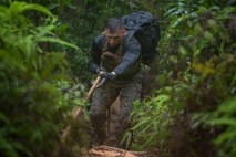 U.S. Marine Corps Marital Arts Program Instructor Trainer Staff Sgt. Cesar Menendezezlozano navigates through an endurance course during a MCMAP Instructor Course at Camp Hansen, Okinawa, Japan, June 20, 2019. Menendezezlozano, manpower chief with Combat Logistics Regiment 35, 3rd Marine Logistics Group, held the instructor course in order to create MCMAP force multipliers not only for the MLG but entire III Marine Expeditionary Force. Menendezezlozano is a native of Chicago, Illinois. (U.S. Marine Corps photo by Lance Cpl. Isaiah Campbell)