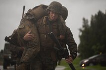 U.S. Marine Corps Sgt. Ismael Rivera-Garcia carries a fellow student during a Marine Corps Martial Arts Program Instructor Course at Camp Hansen, Okinawa, Japan, June 20, 2019. Rivera-Garcia, with III Marine Expeditionary Force Command Element, participated in the MAI Course to become a MCMAP force multiplier. Rivera-Garcia is a native of Ciales, Puerto Rico. (U.S. Marine Corps photo by Lance Cpl. Isaiah Campbell)