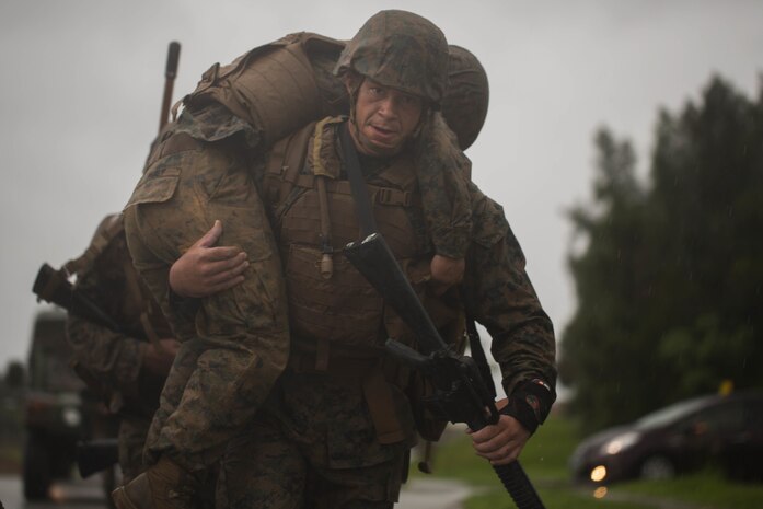 U.S. Marine Corps Sgt. Ismael Rivera-Garcia carries a fellow student during a Marine Corps Martial Arts Program Instructor Course at Camp Hansen, Okinawa, Japan, June 20, 2019. Rivera-Garcia, with III Marine Expeditionary Force Command Element, participated in the MAI Course to become a MCMAP force multiplier. Rivera-Garcia is a native of Ciales, Puerto Rico. (U.S. Marine Corps photo by Lance Cpl. Isaiah Campbell)