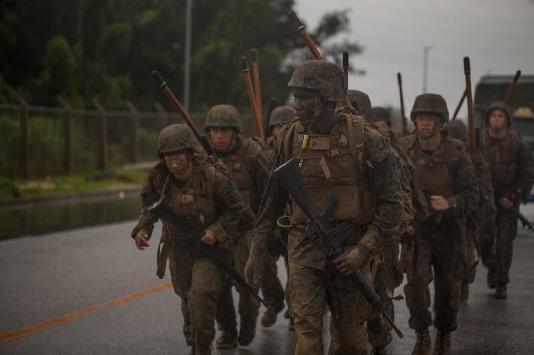 U.S. Marines finish the culminating event during a Marine Corps Martial Arts Program Instructor Course at Camp Hansen, Okinawa, Japan, June 20, 2019. For the culminating event the Marines ran an endurance course in order to push their bodies beyond their anticipated physical limits. (U.S. Marine Corps photo by Lance Cpl. Isaiah Campbell)