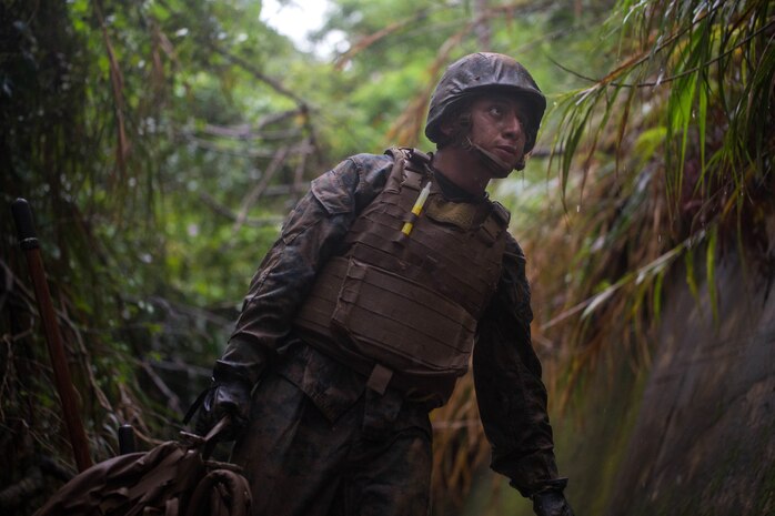 U.S. Marine Corps Cpl. Abimael Reyes-Aguilar navigates through an endurance course during a Marine Corps Martial Arts Program Instructor Course at Camp Hansen, Okinawa, Japan, June 20, 2019. Reyes-Aguilar a food service specialist with Food Service Company, Combat Logistics Regiment 37, 3rd Marine Logistics Group, participated in the instructor course in order to become a MCMAP force multiplier. Reyes-Aguilar is a native of Gardena, California. (U.S. Marine Corps photo by Lance Cpl. Isaiah Campbell)