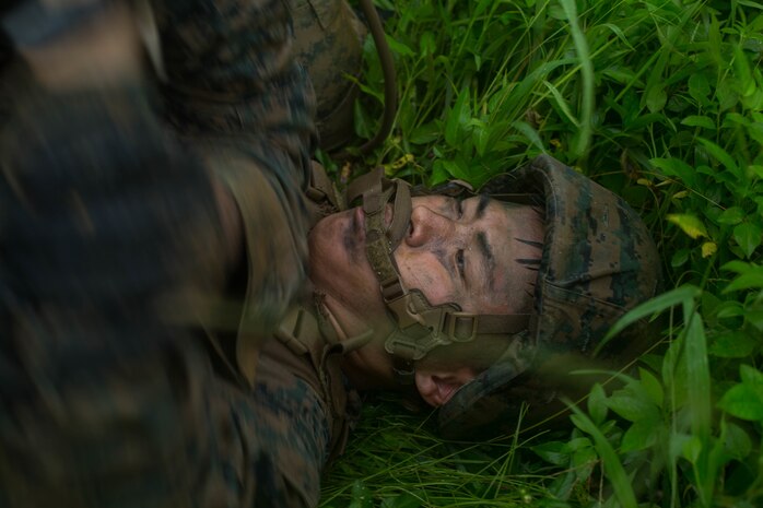 U.S. Marine Corps Cpl. Ricky Pak grapples with a fellow student during a Marine Corps Martial Arts Program Instructor Course at Camp Hansen, Okinawa, Japan, June 20, 2019. Pak, an embarking specialist with Combat Logistics Regiment 37, 3rd Marine Logistics Group, participated in the instructor course to become a MCMAP force multiplier. Pak is a native of Tamuning, Guam. (U.S. Marine Corps photo by Lance Cpl. Isaiah Campbell)