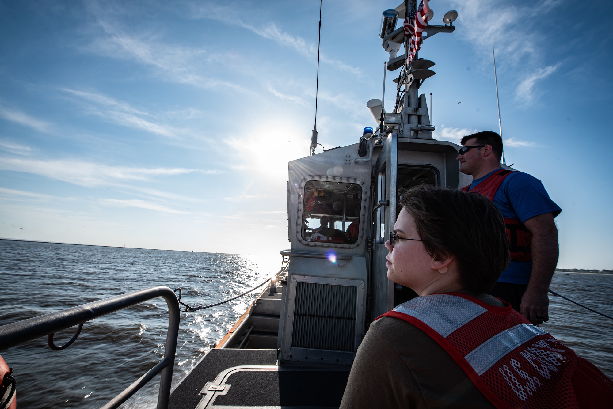 U.S. Airmen assigned to the 20th Fighter Wing ride on the back of a U.S. Coast Guard (USCG) 45-foot response boat off the coast of Tybee Island Coast Guard Station, Georgia, June 21. 2019.