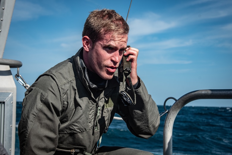 U.S. Air Force Capt. Kyle Rasmussen, 55th Fighter Squadron pilot, makes a mayday call during a search-and-recovery exercise off the coast of Tybee Island Coast Guard Station, Georgia, June 21. 2019.