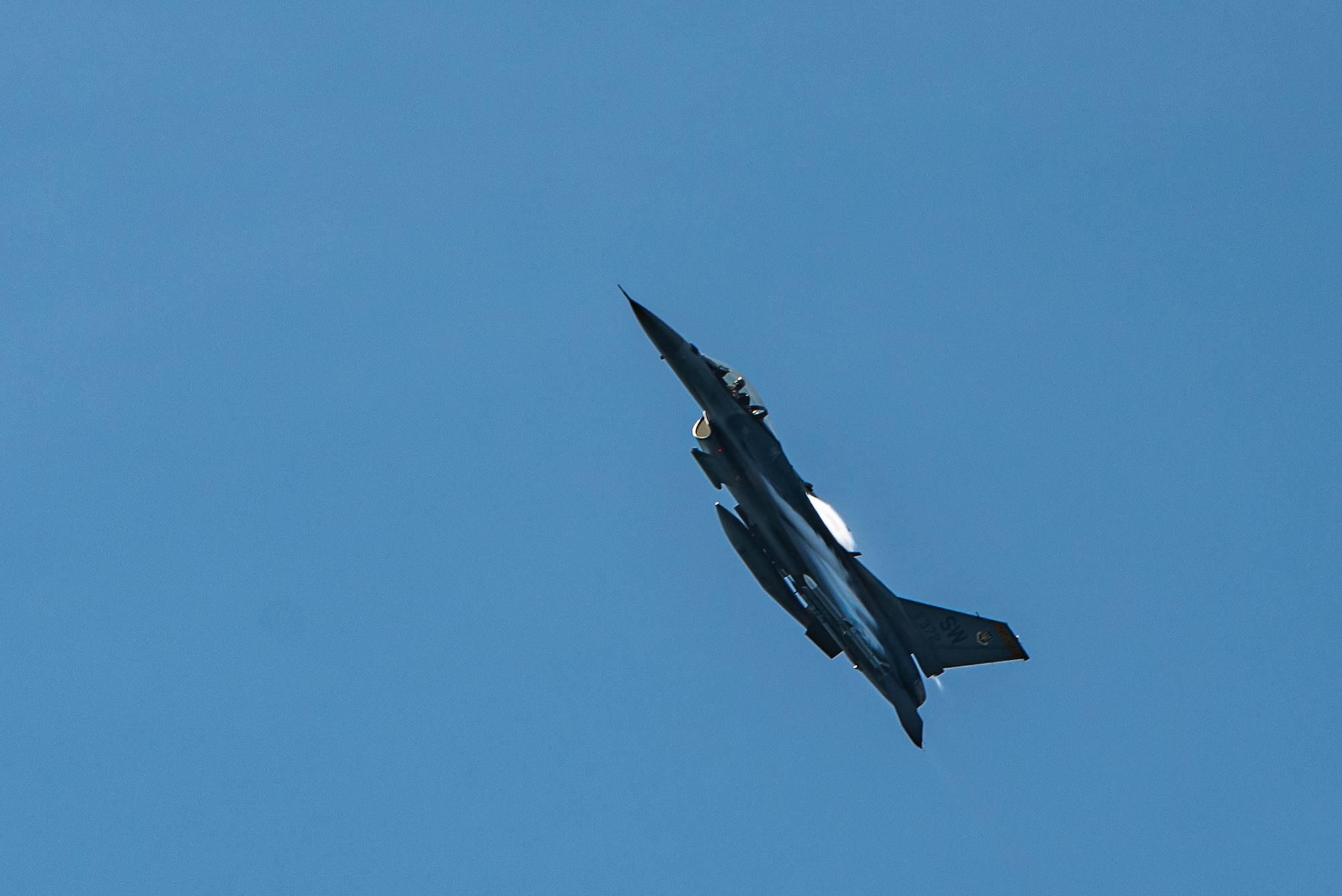 An F-16CM Viper performs a show-of-force over the Atlantic Ocean during a joint-training exercise with the U.S. Coast Guard off the coast of Tybee Island Coast Guard Station, Georgia, June 21. 2019.