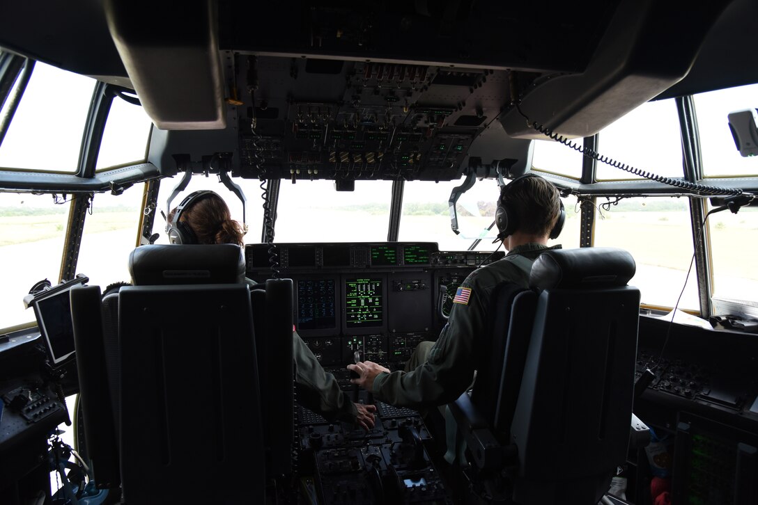 Lt. Col. Stephanie Brown and Maj. Ben Jones, pilots for the 815th Airlift Squadron from the 403rd Wing, throttle the C-130J for takeoff after completing the air/land mission for exercise Swift Response 19, June 19, 2019. The exercise is one of the premier military crisis response training events featuring high readiness airborne forces from eight NATO nations. Activities include intermediate staging base operations, multiple airborne operations, and several air assault operations. The Swift Response exercises have had great success in creating a foundation for the strong relationships we share with several European allies and partners today. (U.S. Air Force photo by Master Sgt. Jessica Kendziorek)