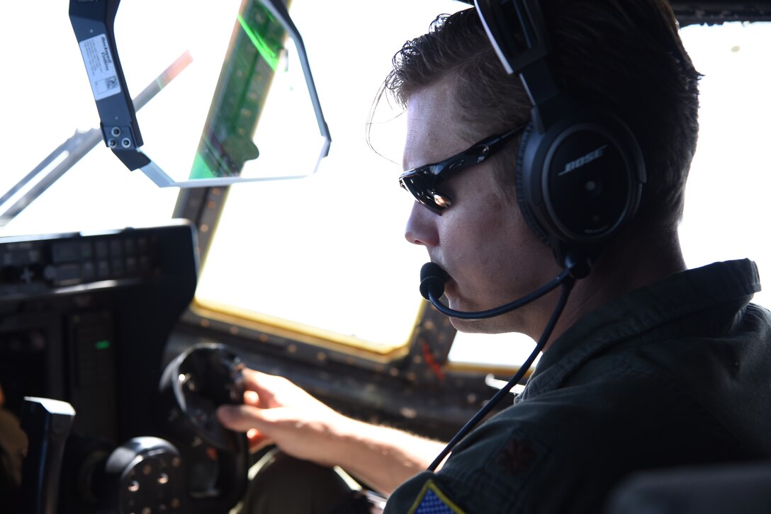 Maj. Ben Jones, pilot for the 815th Airlift Squadron from the 403rd Wing, checks the instruments and flight path for the air/land missionfor exercise Swift Response 19, June 19, 2019. The exercise is one of the premier military crisis response training events featuring high readiness airborne forces from eight NATO nations. Activities include intermediate staging base operations, multiple airborne operations, and several air assault operations. The Swift Response exercises have had great success in creating a foundation for the strong relationships we share with several European allies and partners today. (U.S. Air Force photo by Master Sgt. Jessica Kendziorek)