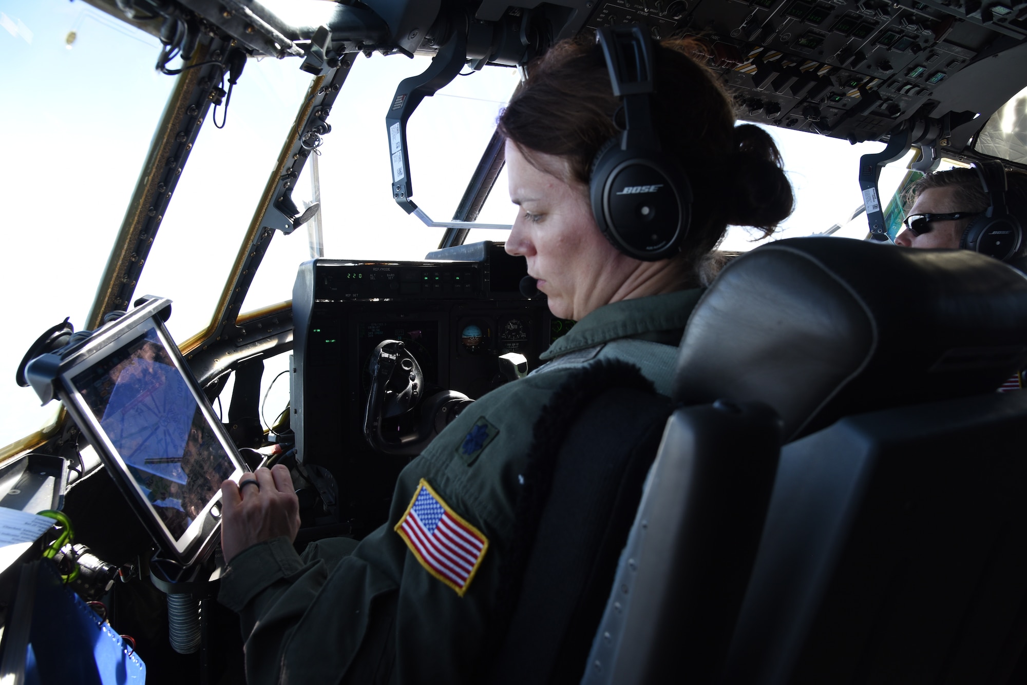 Lt. Col. Stephanie Brown, pilot for the 815th Airlift Squadron from the 403rd Wing, checks the instruments and flight path for the air/land mission for exercise Swift Response 19, June 19, 2019. The exercise is one of the premier military crisis response training events featuring high readiness airborne forces from eight NATO nations. Activities include intermediate staging base operations, multiple airborne operations, and several air assault operations. The Swift Response exercises have had great success in creating a foundation for the strong relationships we share with several European allies and partners today. (U.S. Air Force photo by Master Sgt. Jessica Kendziorek)