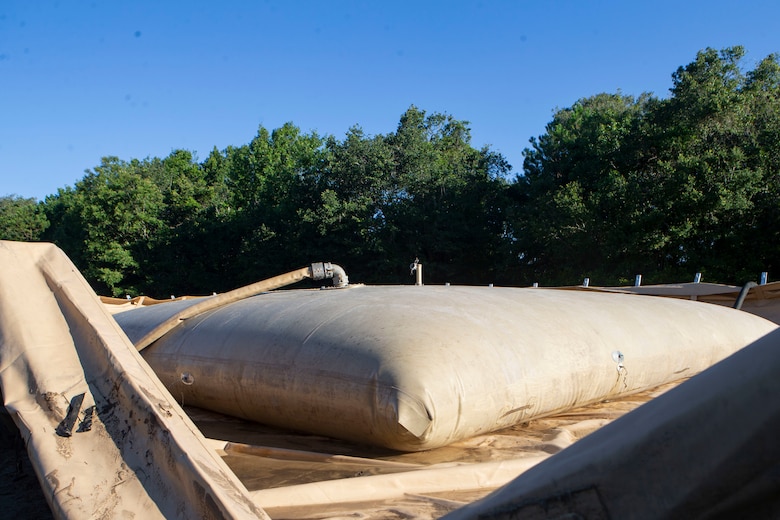 U.S. Marines with Bulk Fuel Company, 8th Engineer Support Battalion, 2nd Marine Logistics Group, built a 150,000 gallon tactical fuel system during a Bulk Fuel exercise at Camp Lejeune, N.C., June 19, 2019. The Marines with 8th ESB ran fuel lines, patrolled the fuel sites and provided all around security to remain proficient in fueling support operations. (U.S. Marine Corps photo by Lance Cpl. Adaezia L. Chavez)