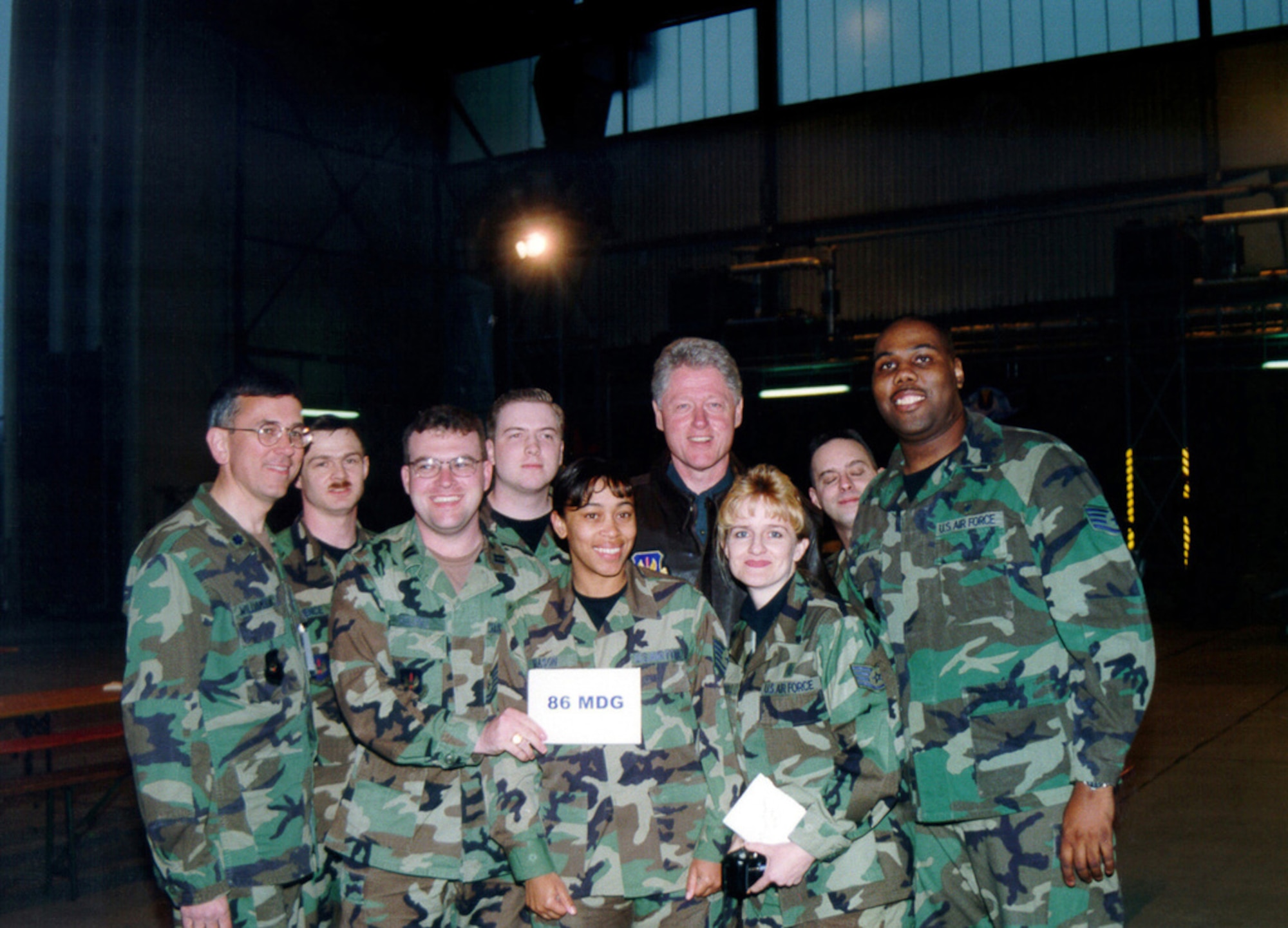 Former President William Jefferson Clinton poses for a photo with a member of the 86th Medical Group, Ramstein Air Base, Germany, during a dinner held at the base, on May 5, 1999. The former President visited Ramstein Air Base to thank the troops for their support of Operations Allied force and Sustain Hope. (U.S. Air Force photo by Senior Airman Brian Biosvert)