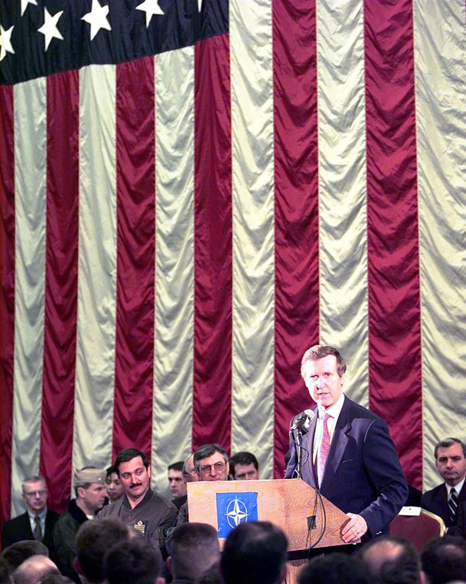 Former Defense Secretary William S. Cohen addresses personnel stationed and deployed to Aviano Air Base, Italy, supporting NATO Operation Allied Force, April 8, 1999. In a report to Congress on the operations in the following January, Cohen recognized the efforts of the Air Force Medical Service. (U.S. Air Force photo by Senior Airman Stan Parker)