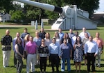IMAGE: DAHLGREN, Va. (June 20, 2019) - New first-line supervisors from divisions across the Naval Warfare Centers are pictured at the 16-inch naval gun during their tour of Naval Surface Warfare Center Dahlgren Division (NSWCDD). They completed a five-day course called 'Propel' that provides an introductory level awareness of Warfare Center expectations for supervisors. The NSWCDD tour and briefings - focusing on the Electromagnetic Railgun Facility, the Potomac River Test Range, and the Human Performance Laboratory - gave the Propel students a deeper look into the work at Dahlgren. Meanwhile, they have been increasing their collaboration and understanding of operations throughout the Warfare Centers. (U.S. Navy photo/Released)