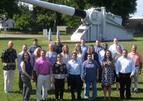 IMAGE: DAHLGREN, Va. (June 20, 2019) - New first-line supervisors from divisions across the Naval Warfare Centers are pictured at the 16-inch naval gun during their tour of Naval Surface Warfare Center Dahlgren Division (NSWCDD). They completed a five-day course called 'Propel' that provides an introductory level awareness of Warfare Center expectations for supervisors. The NSWCDD tour and briefings - focusing on the Electromagnetic Railgun Facility, the Potomac River Test Range, and the Human Performance Laboratory - gave the Propel students a deeper look into the work at Dahlgren. Meanwhile, they have been increasing their collaboration and understanding of operations throughout the Warfare Centers. (U.S. Navy photo/Released)