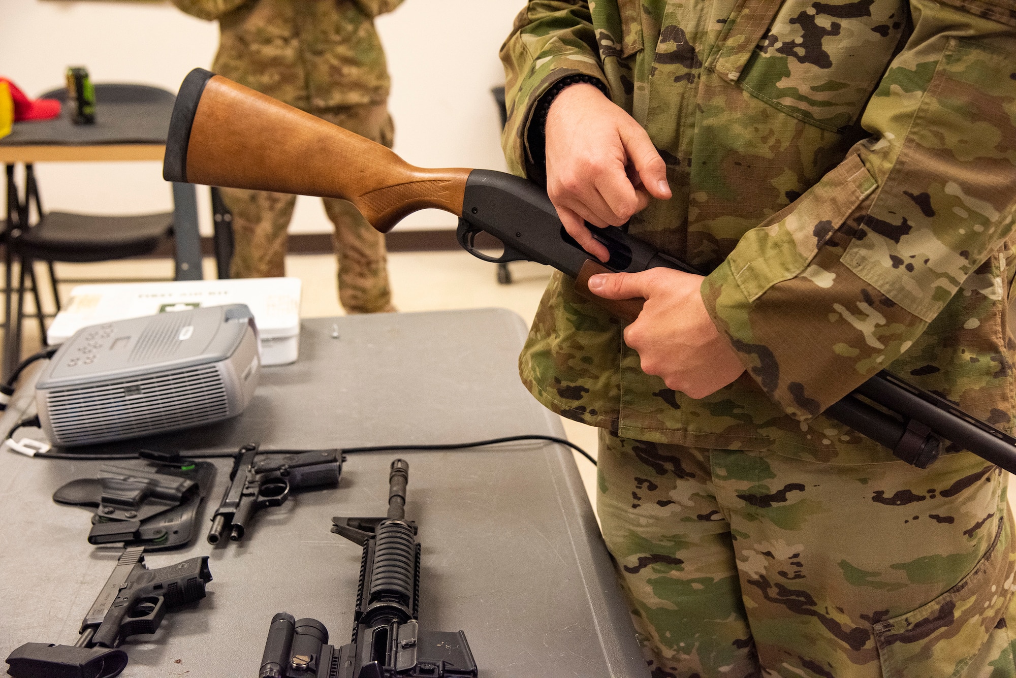 A 23d Security Forces Squadron Combat Arms Training and Maintenance instructor, describes the internal components of a firearm during a weapons safety class, June 18, 2019, at Moody Air Force Base, Ga. Weapons safety courses teach safe habits with firearms that ensure your own safety and the safety of those around you. (U.S. Air Force photo by Airman Azaria Foster)