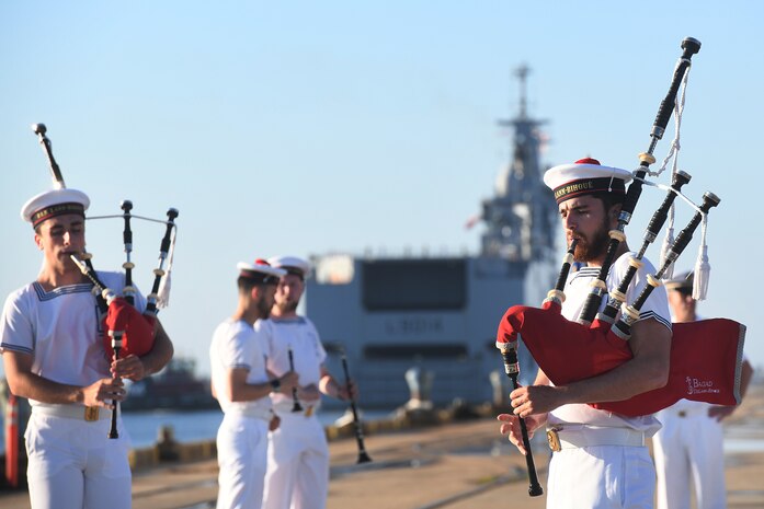 Marine Nationale (French Navy) Sailors perform as Landing Helicopter Dock Tonnerre navigates toward the Columbus Terminal Port as part of a deployment stopover June 21, 2019, in Charleston, S.C. U.S. Navy Cmdr. Patrick Sutton, Naval Support Activity Charleston executive officer and 628th Mission Support Group deputy commander, spoke with leaders of LHD Tonnerre to ensure the crew received support during their stay in Charleston. Engagements such as this provide opportunities to strengthen partnerships between allies.