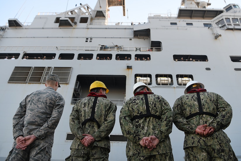 U.S. service members watch the Marine Nationale (French Navy) Landing Helicopter Dock Tonnerre navigate into the Columbus Terminal Port as part of a deployment stopover June 21, 2019, in Charleston, S.C. U.S. Navy Cmdr. Patrick Sutton, Naval Support Activity Charleston executive officer and 628th Mission Support Group deputy commander, spoke with leaders of LHD Tonnerre to ensure the crew received support needed while in Charleston. Engagements such as this provide opportunities to strengthen partnerships between allies.