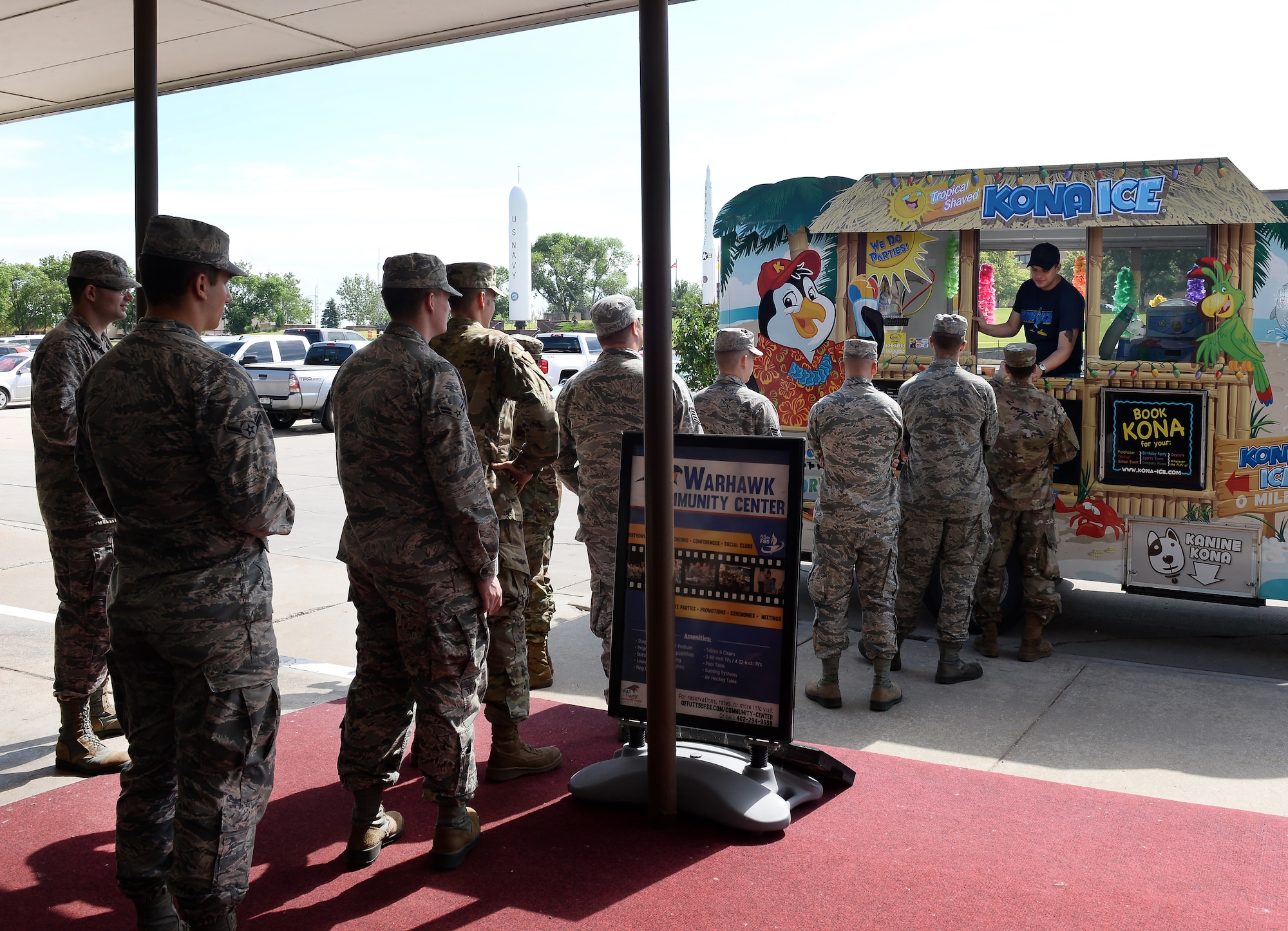 Team Offutt members line up June 20, 2019, outside the Kona Ice truck during the shaved ice event at the Warhawk Community Center on Offutt Air Force Base, Nebraska. It was a special way to give back to the Team Offutt members who were displaced by this year’s historic flood. (U.S. Air Force photo by Charles J. Haymond)