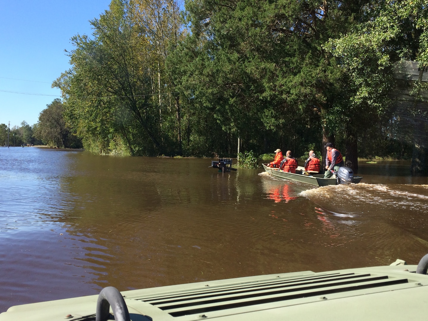 Deputies use their Humvee to travel Dobson Chapel Rd. during Hurricane Matthew.