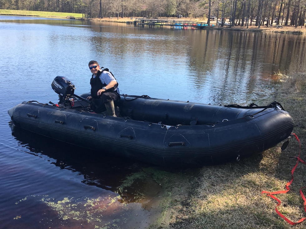 Deputy Jerry Griffin helps test one of the Zodiac boats after they were received at Duplin County.