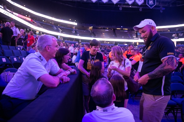 U.S. Air Force Gen. Paul J. Selva, vice chairman of the Joint Chiefs of Staff, chats with athletes and their families during the 2019 Department of Defense Warrior Games Opening Ceremony in Tampa Bay, Fla., June 22, 2019. Approximately 300 wounded, ill and injured service members and veterans will participate in 13 athletic competitions over 10 days as U.S. Special Operations Command hosts the 2019 DoD Warrior Games. (DoD photo by U.S. Army Sgt. James K. McCann)