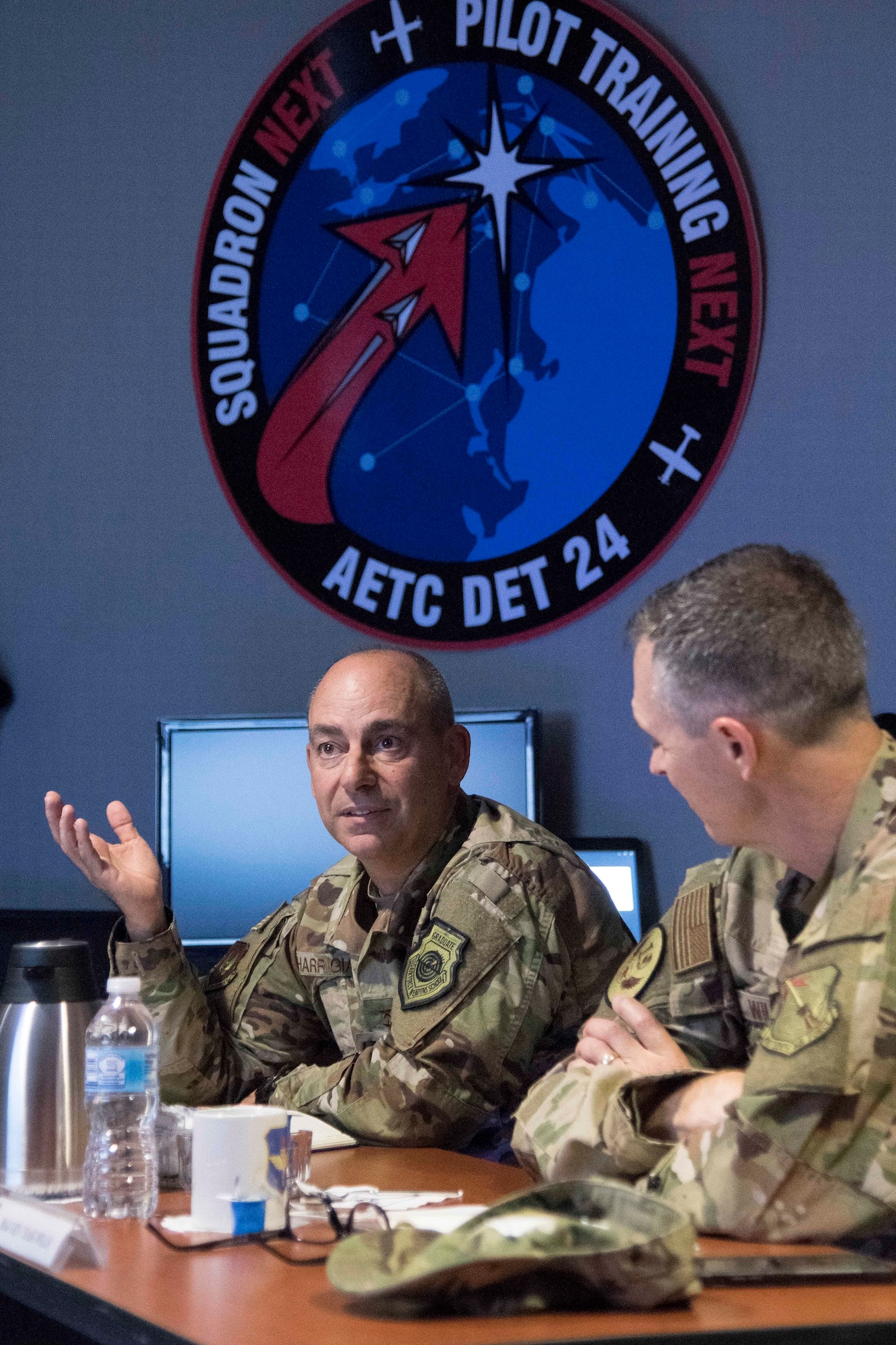 Gen. Jeffrey L. Harrigian, United States Air Forces Europe and United States Air Forces Africa commander, asks questions during a briefing on the training capabilities of Pilot Training Next during a visit to Detachment 24 at Joint Base San Antonio-Randolph, Texas, June 24, 2019. PTN is an Air Education and Training Command program to explore and prototype a pilot training environment that integrates various technologies to produce pilots in a learning-focused manner. (U.S. Air Force photo by Sean M. Worrell)