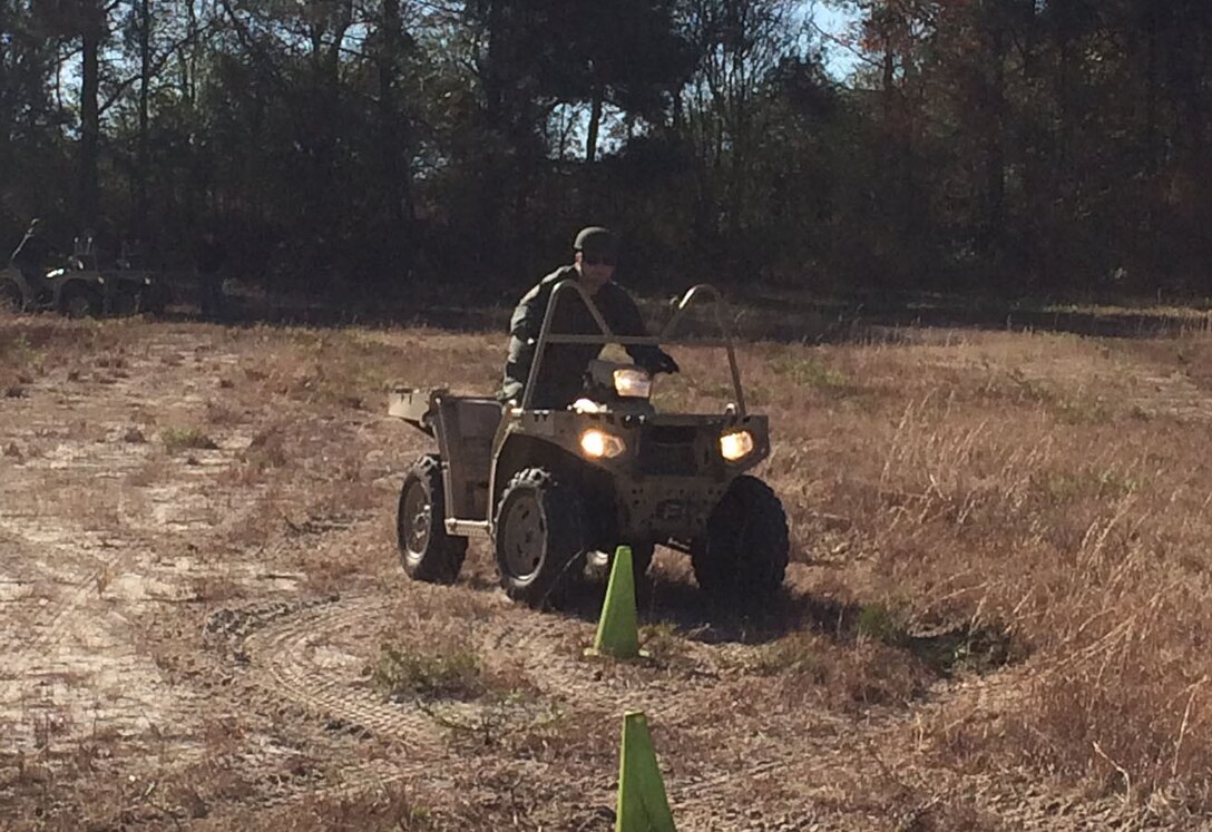 Deputy Billy Smith hones his skills on one of the Polaris 850 all-terrain vehicles.