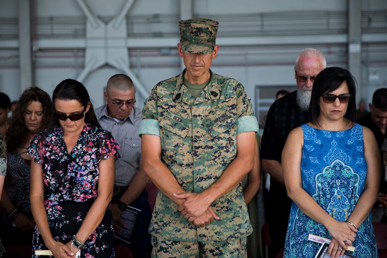 U.S. Marine Corps Sgt.Maj. Brian D. Olea, outgoing Sergeant Major, bows his head for the Chaplain’s invocation during the Marine Operational Test and Evaluation Squadron One Relief and Appointment Ceremony at Marine Corps Air Station Yuma Ariz., June 6, 2019. The Relief and Appointment ceremony is an honored product of the rich heritage of Naval tradition. The heart of the ceremony is the passing of the NCO Sword by the Activity Commander from the outgoing Sergeant Major to the new Sergeant Major which signifies the transfer of responsibility, accountability, and authority, from one individual to another. (U.S. Marine Corps photo by Cpl. Joel Soriano)