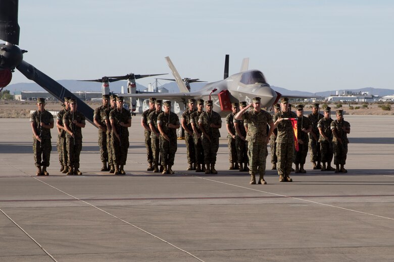 U.S. Marines with Marine Operational Test and Evaluation Squadron One participate in the battle color ceremony as part of the Relief and Appointment Ceremony at Marine Corps Air Station Yuma Ariz., June 6, 2019. The Relief and Appointment ceremony is an honored product of the rich heritage of Naval tradition. The heart of the ceremony is the passing of the NCO Sword by the Activity Commander from the outgoing Sergeant Major to the new Sergeant Major which signifies the transfer of responsibility, accountability, and authority, from one individual to another. (U.S. Marine Corps photo by Cpl. Joel Soriano)