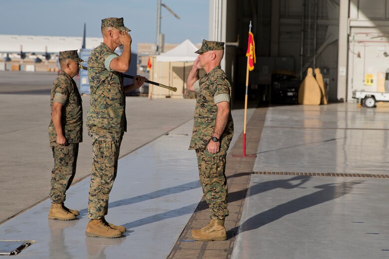 U.S. Marine Corps Sgt.Maj. Brian D. Olea, the outgoing sergeant major of Marine Operational Test and Evaluation Squadron (VMX) One, passes the sword during the VMX-1 Relief and Appointment Ceremony at Marine Corps Air Station Yuma Ariz., June 6, 2019. The Relief and Appointment ceremony is an honored product of the rich heritage of Naval tradition. The heart of the ceremony is the passing of the NCO Sword by the Activity Commander from the outgoing Sergeant Major to the new Sergeant Major which signifies the transfer of responsibility, accountability, and authority, from one individual to another. (U.S. Marine Corps photo by Cpl. Joel Soriano)
