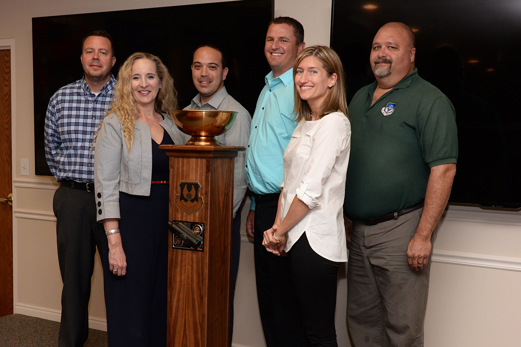 Aerospace Sustainment Directorate team members (left to right) Rich Kuykendall, Cathy Barker, Adam Payne, Braeden Stander, Jeni Owen and Lance Haycock receive the Logistics Airmen Mastering Possibilities, or L-A-M-P, Award trophy June 6, 2019, at Hill Air Force Base, Utah. The award established in January includes a traveling trophy and is presented monthly to the Ogden Air Logistic Complex’s most deserving team or unit. (U.S. Air Force photo by Alex R. Lloyd)