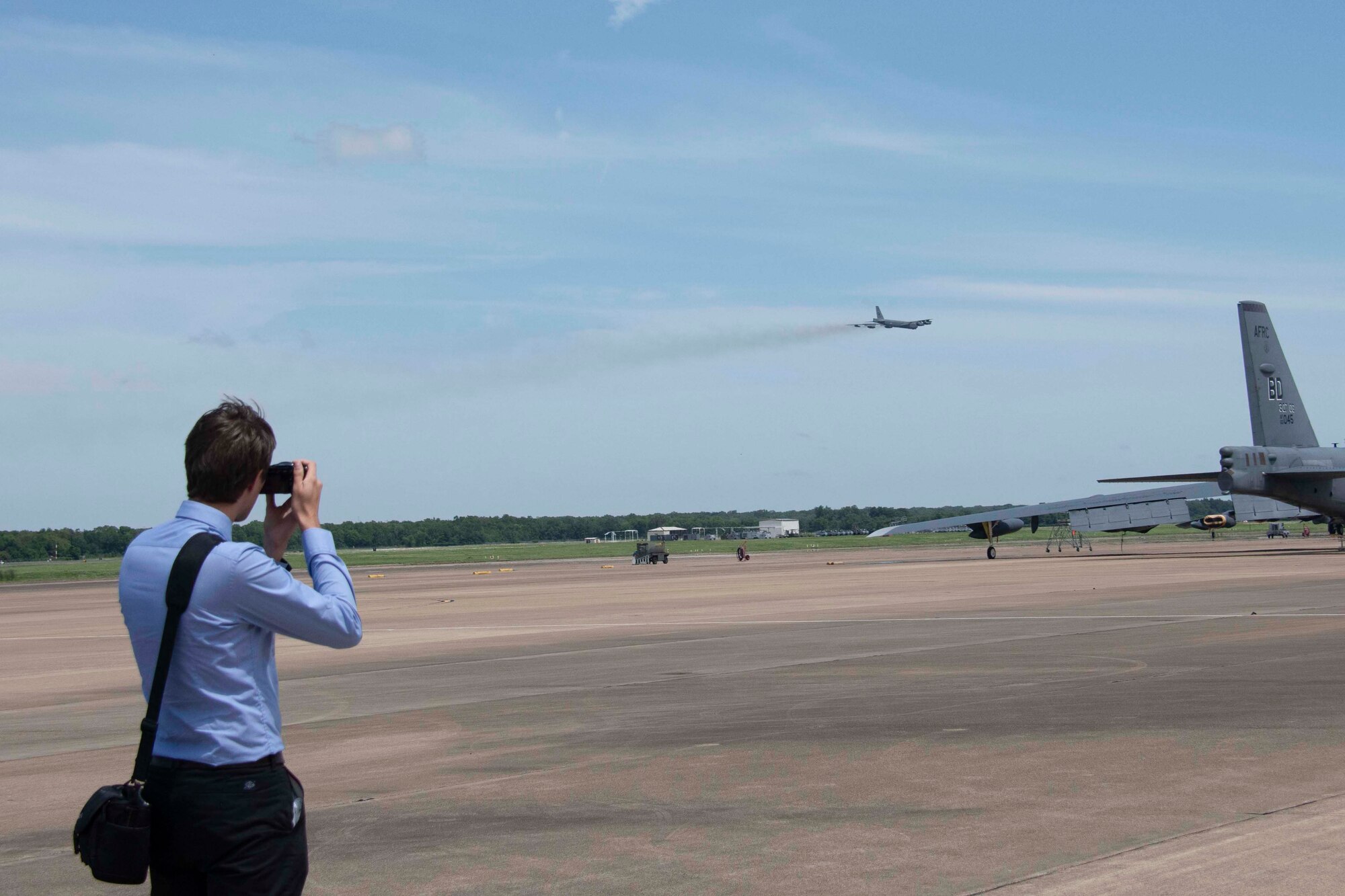 A member of a Czech Republic delegation takes a photo of a B-52 Stratofortress at Barksdale Air Force Base, Louisiana, June 24, 2019.  Nearly a dozen representatives from the Czech Rep. and Slovakia visited the base to strengthen ties that were forged between the two countries and the 307th Bomb Wing more than a decade ago. (U.S. Air Force photo by Master Sgt. Ted Daigle)