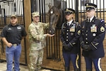 Sgt. Maj. of the Army Daniel A. Dailey and members of the 3rd U.S. Infantry Regiment (The Old Guard) and U.S. Army North's caisson team stands with Dailey, the newest member of the ARNORTH's caisson team, during a horse dedication at Joint Base San Antonio-Fort Sam Houston June 17. Caisson horses with ARNORTH have been named in honor of retired Sergeants Major of the Army and Medal of Honor recipients from Fifth Army in World War II.