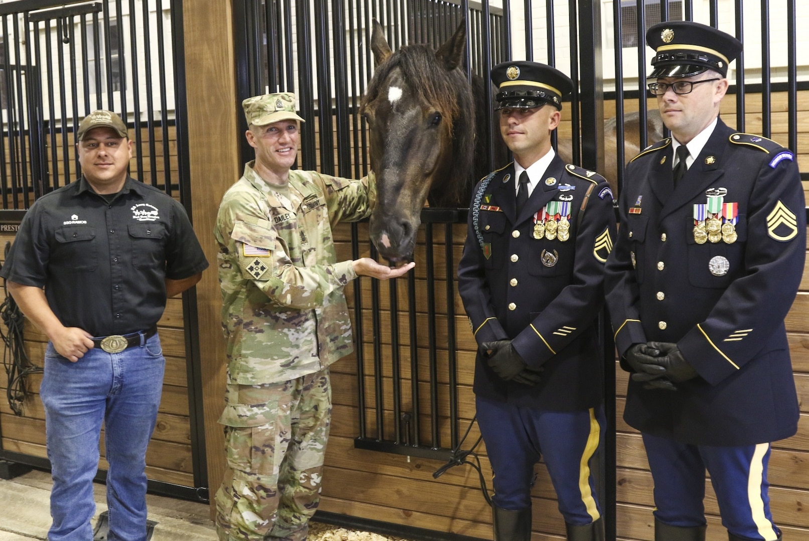 Sgt. Maj. of the Army Daniel A. Dailey and members of the 3rd U.S. Infantry Regiment (The Old Guard) and U.S. Army North's caisson team stands with Dailey, the newest member of the ARNORTH's caisson team, during a horse dedication at Joint Base San Antonio-Fort Sam Houston June 17. Caisson horses with ARNORTH have been named in honor of retired Sergeants Major of the Army and Medal of Honor recipients from Fifth Army in World War II.