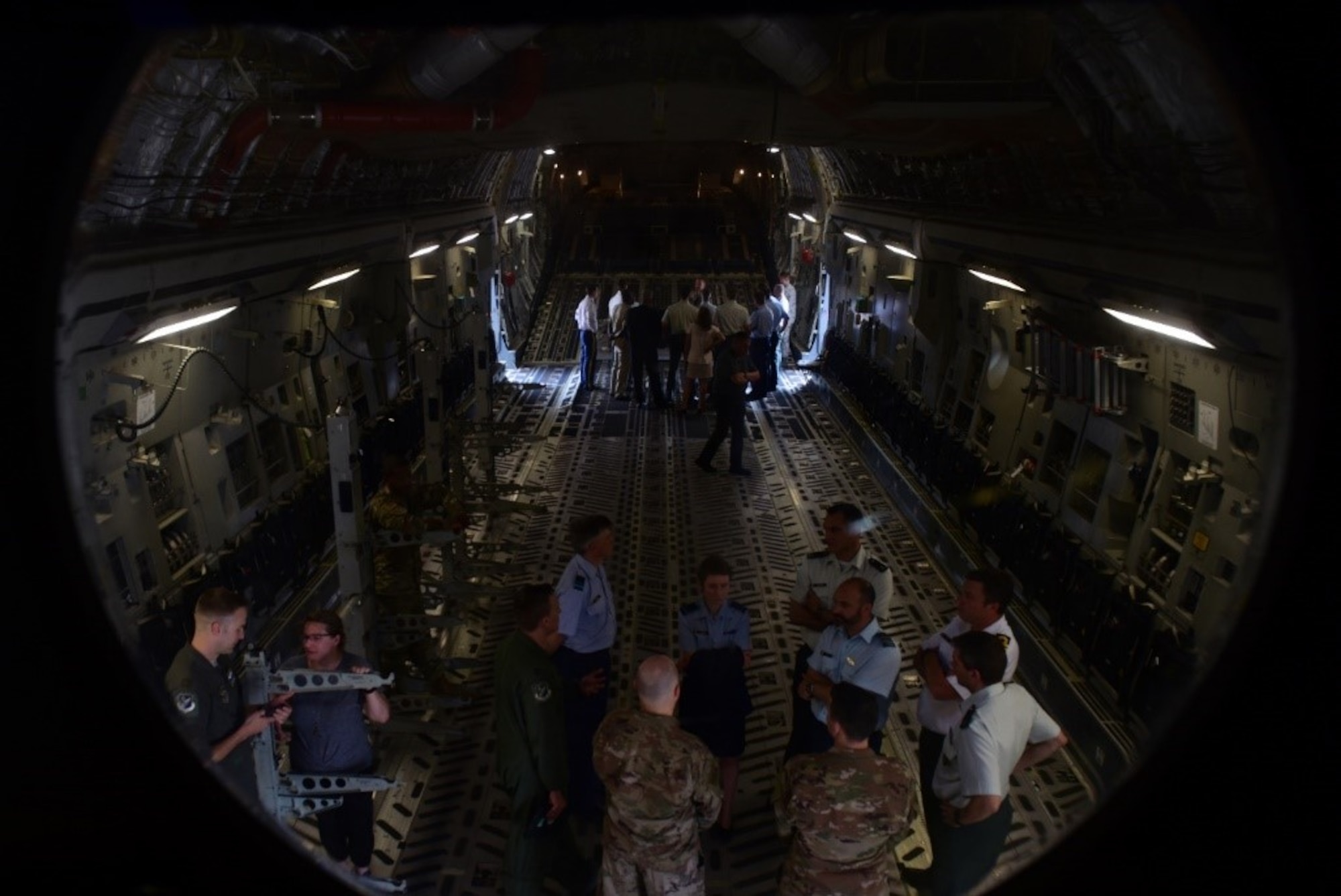 Belgium Royal Military Academy students get an inside look of a C-17 Globemaster III at Joint Base McGuire-Dix-Lakehurst, New Jersey, June 20, 2019. Students were able to tour the aircraft and speak one- on-one with the crew. (U.S. Air Force photo by Airman 1st Class Shay Stuart)