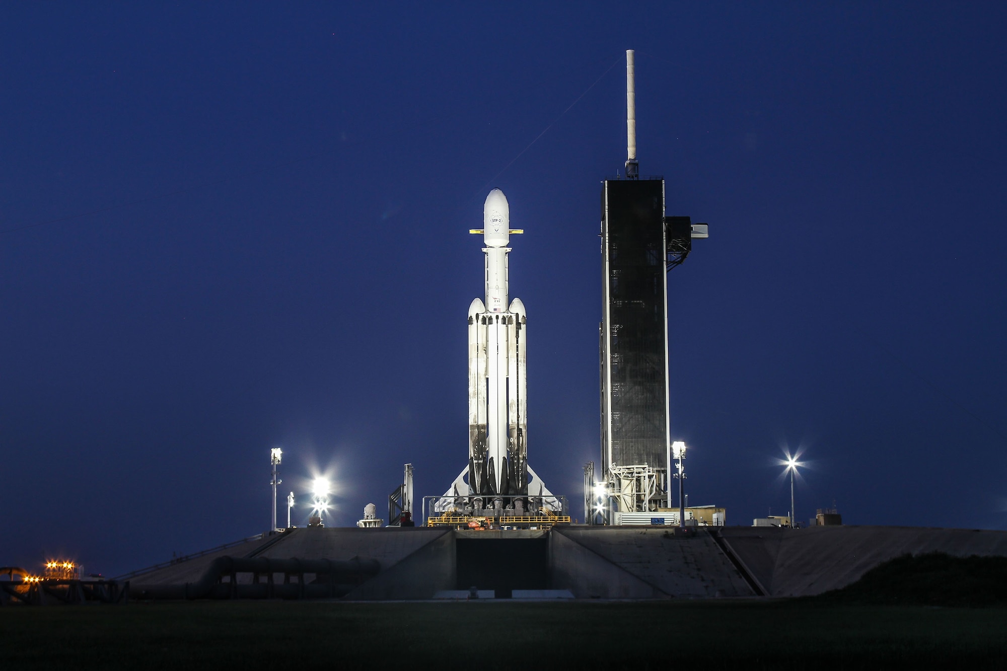 Sporting two, previously used side boosters, the SpaceX Falcon Heavy launch vehicle stands tall on Launch Complex-39A at NASA's Kennedy Space Center in the early morning hours of June 24, 2019. The four-hour launch window opens tonight at 11:30 p.m. Eastern, 8:30 p.m. Pacific. (Photo: SpaceX)