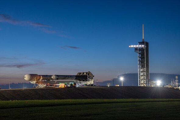 A SpaceX Falcon Heavy launch vehicle atop the Mobile Strongback Transporter, containing the Space Test Program-2 payloads encapsulated within the protective fairing, rolls up to position at Launch Complex-39A at NASA's Kennedy Space Center. (Photo: SpaceX)