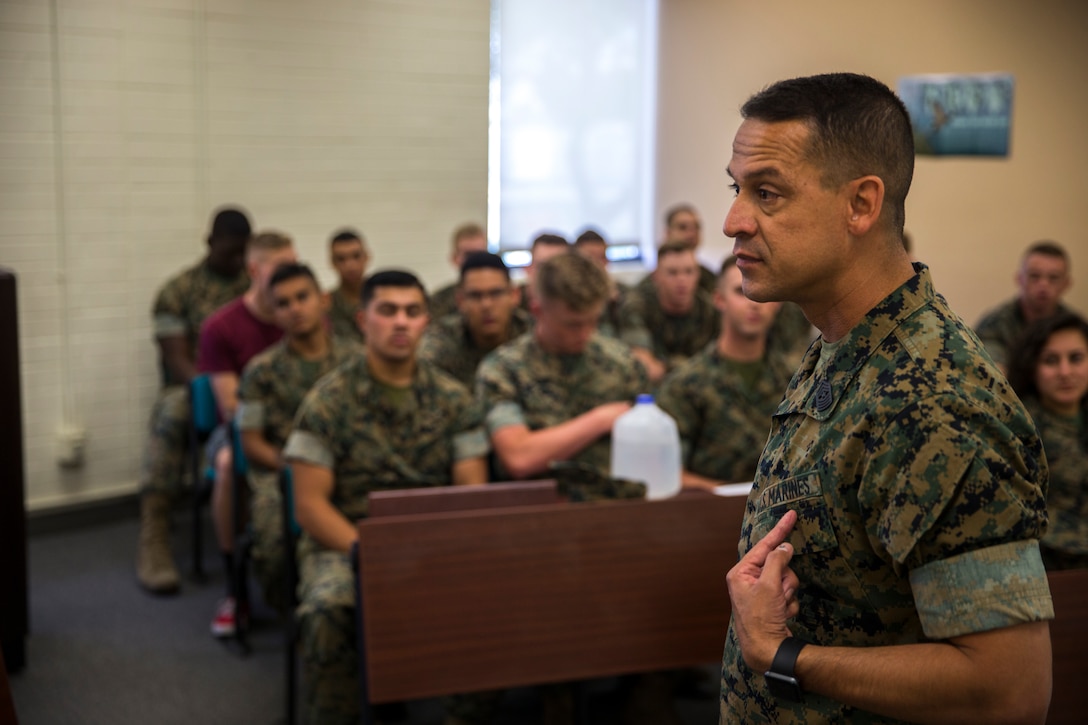 U.S. Marine Corps Lt.Col. James C. Paxton and Sgt.Maj. Fabian Casillas the commanding officer and sergeant major of Marine Corps Air Station (MCAS) Yuma's Headquarters & Headquarters Squadron (H&HS) welcome the new Marines and Sailors assigned to H&HS during a Welcome Aboard brief at MCAS Yuma, Ariz., June 12, 2019. The H&HS "Guardians" are responsible for all day-to- day operations on the air station, with approximately 800 Marines and Sailors are assigned to the Squadron, as well as around 1,200 civilians who work on the air station. (U.S. Marine Corps photo by Lance Cpl. John Hall)