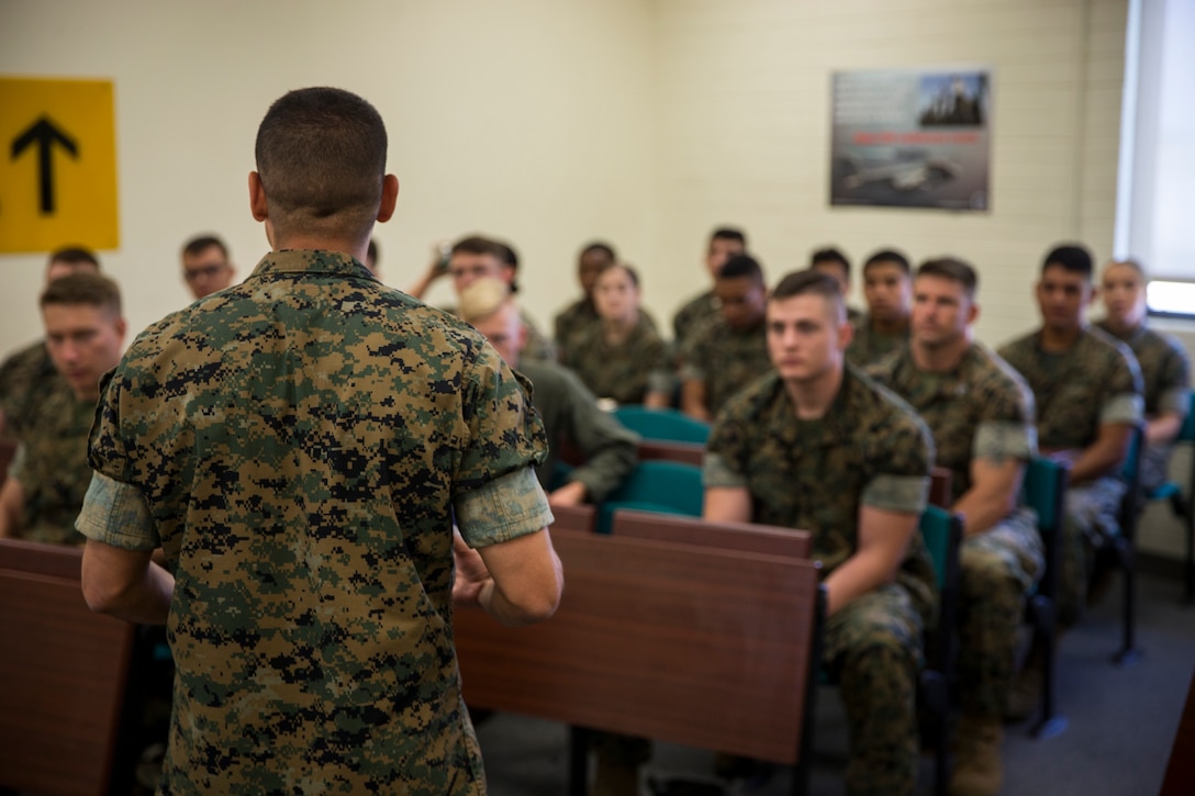 U.S. Marine Corps Lt.Col. James C. Paxton and Sgt.Maj. Fabian Casillas the commanding officer and sergeant major of Marine Corps Air Station (MCAS) Yuma's Headquarters & Headquarters Squadron (H&HS) welcome the new Marines and Sailors assigned to H&HS during a Welcome Aboard brief at MCAS Yuma, Ariz., June 12, 2019. The H&HS "Guardians" are responsible for all day-to- day operations on the air station, with approximately 800 Marines and Sailors are assigned to the Squadron, as well as around 1,200 civilians who work on the air station. (U.S. Marine Corps photo by Lance Cpl. John Hall)