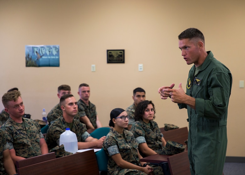 U.S. Marine Corps Lt.Col. James C. Paxton and Sgt.Maj. Fabian Casillas the commanding officer and sergeant major of Marine Corps Air Station (MCAS) Yuma's Headquarters & Headquarters Squadron (H&HS) welcome the new Marines and Sailors assigned to H&HS during a Welcome Aboard brief at MCAS Yuma, Ariz., June 12, 2019. The H&HS "Guardians" are responsible for all day-to- day operations on the air station, with approximately 800 Marines and Sailors are assigned to the Squadron, as well as around 1,200 civilians who work on the air station. (U.S. Marine Corps photo by Lance Cpl. John Hall)