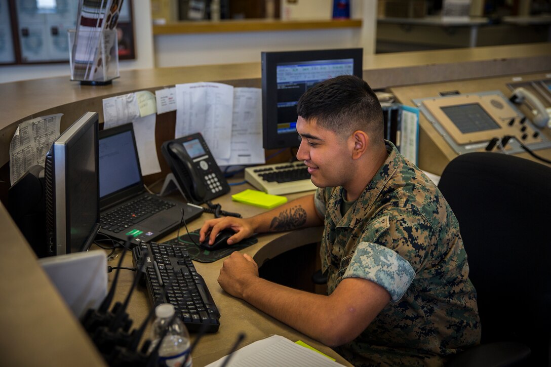 U.S. Marine Corps Lance Cpl. Jonathan Hernandez, a flight dispatcher with Base Operations Marine Corps Air Station (MCAS) Yuma’s Headquarters & Headquarters Squadron (H&HS) poses for a photograph at MCAS Yuma, Ariz., June 12, 2019. As a flight dispatcher, Hernandez is responsible for the preparation of operation plans and orders and compiling data for and preparing operations and aviation safety reports. (U.S. Marine Corps photo by Lance Cpl. John Hall)