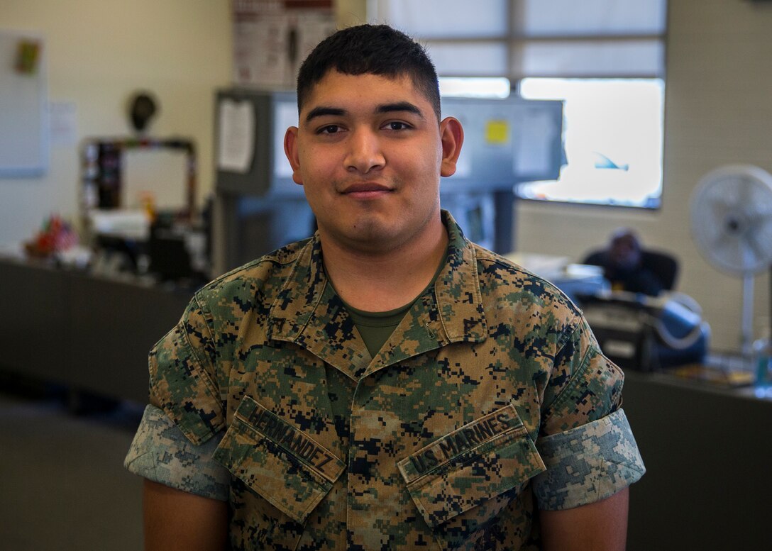 U.S. Marine Corps Lance Cpl. Jonathan Hernandez, a flight dispatcher with Base Operations Marine Corps Air Station (MCAS) Yuma’s Headquarters & Headquarters Squadron (H&HS) poses for a photograph at MCAS Yuma, Ariz., June 12, 2019. As a flight dispatcher, Hernandez is responsible for the preparation of operation plans and orders and compiling data for and preparing operations and aviation safety reports. (U.S. Marine Corps photo by Lance Cpl. John Hall)